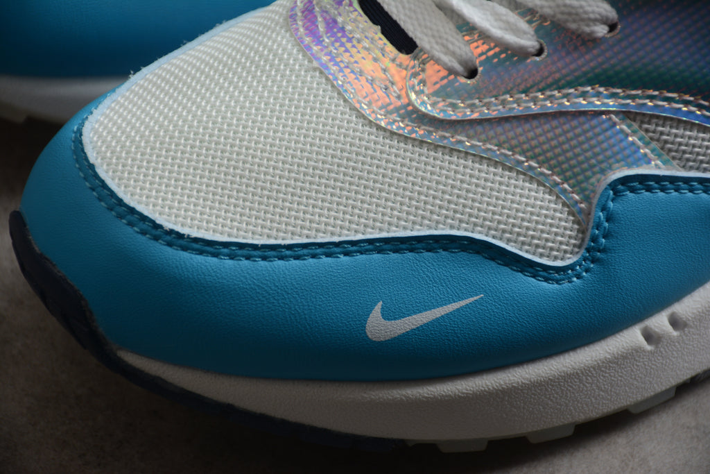 Air Max 1 – Gris / Naranja / Azul