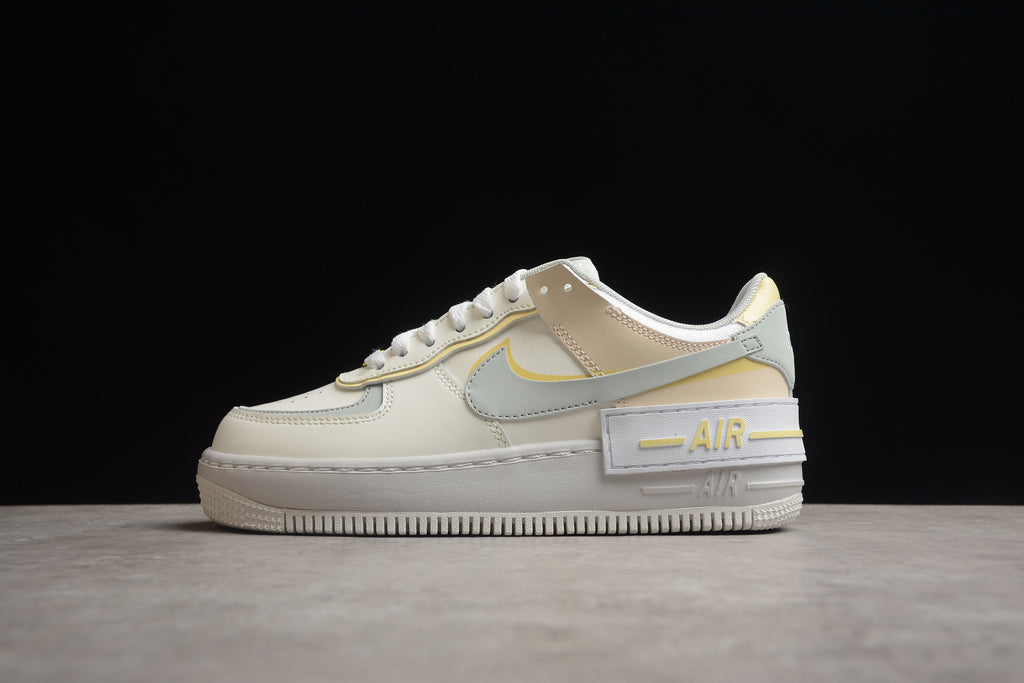 Air Force 1 Shadow – Gris / Rosa / Dorado