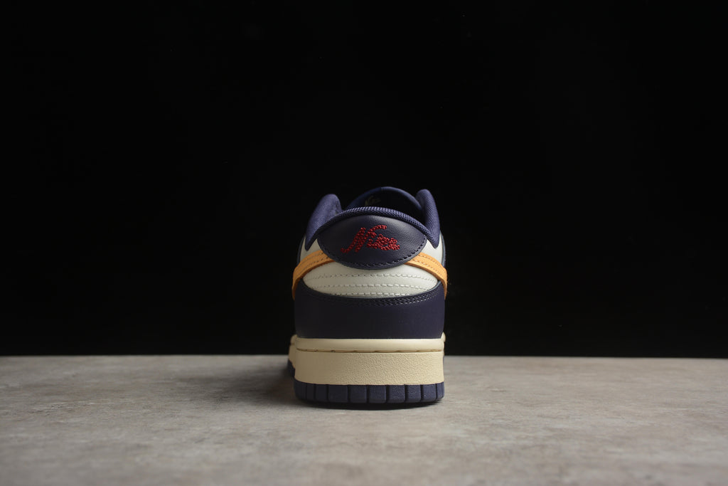 Dunk SB – Azul Oscuro / Blanco / Amarillo