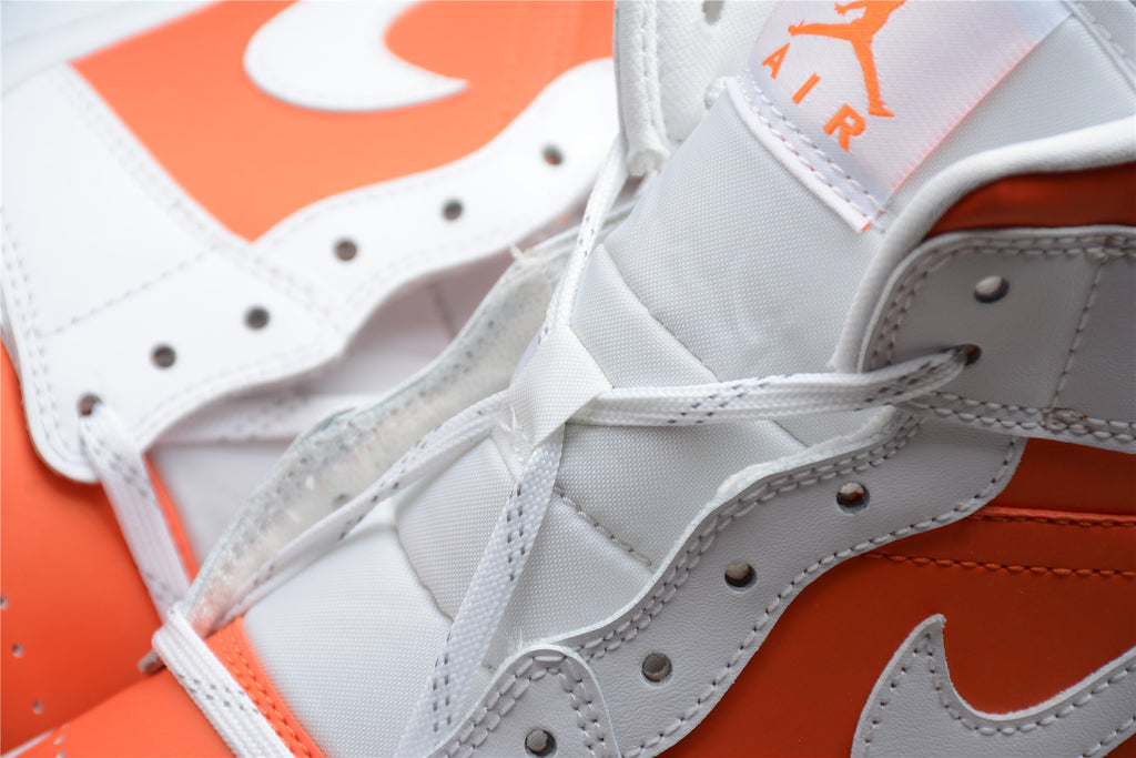 Air Jordan 1 Mid – Blanco / Naranja