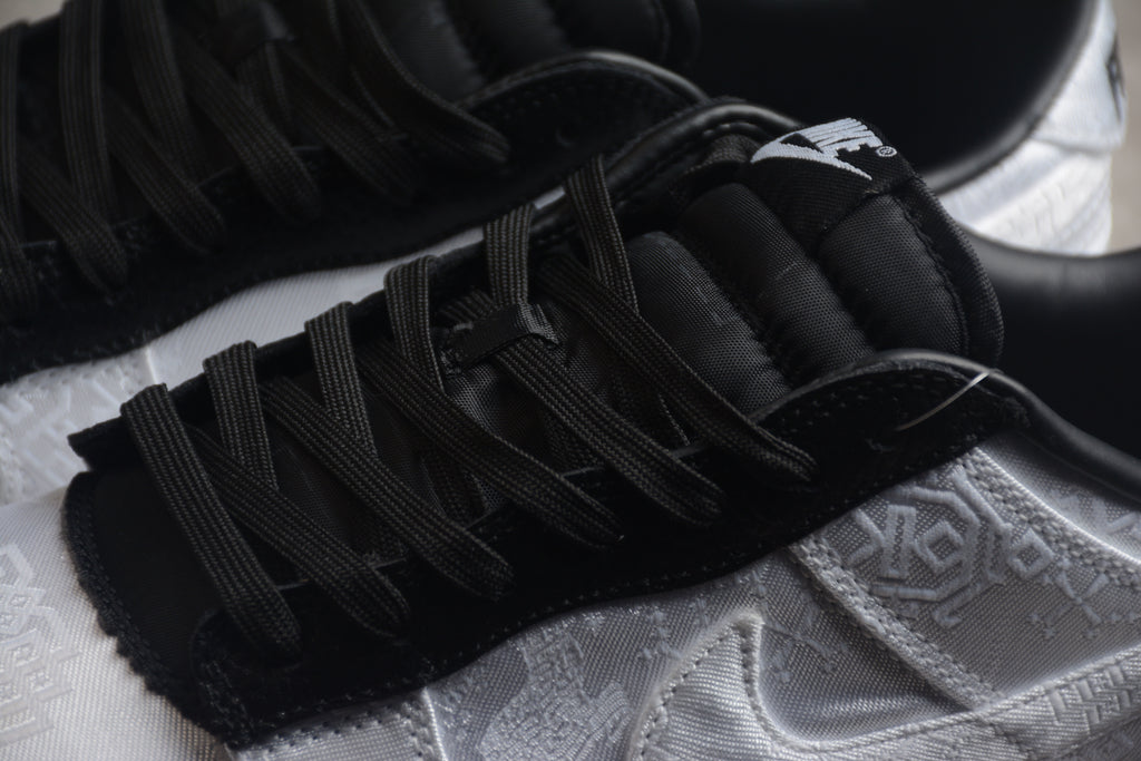 Dunk SB – Blanco / Negro
