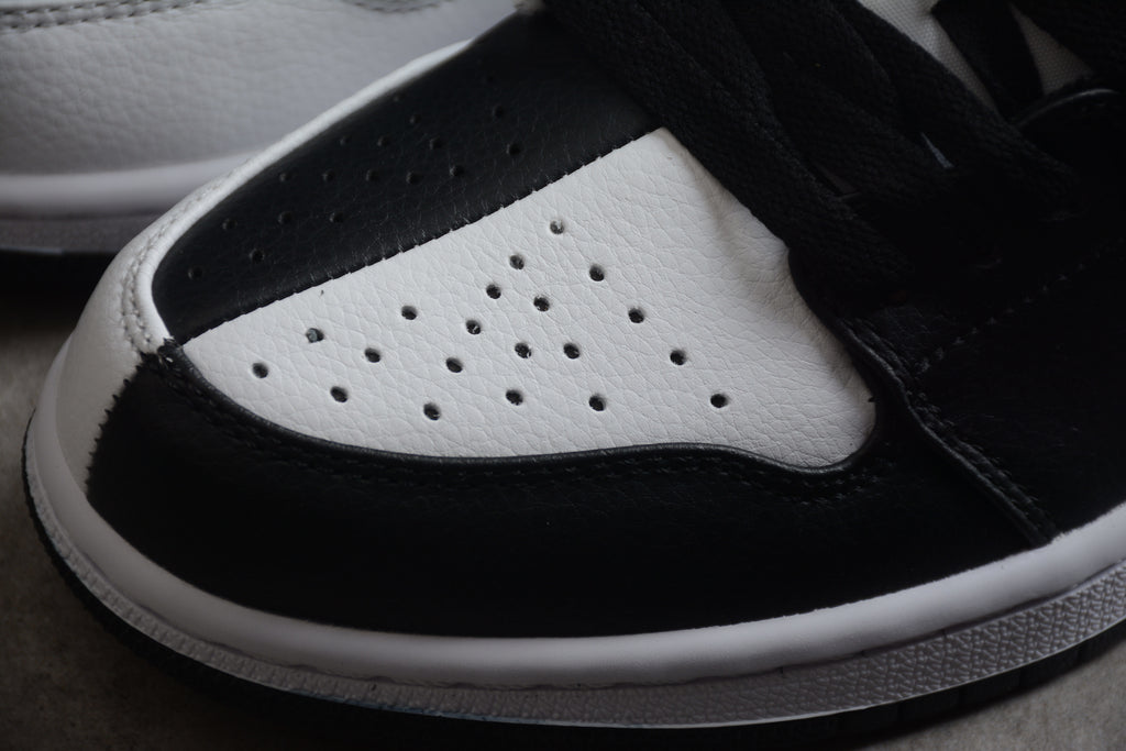 Jordan 1 Low – Negro / Blanco