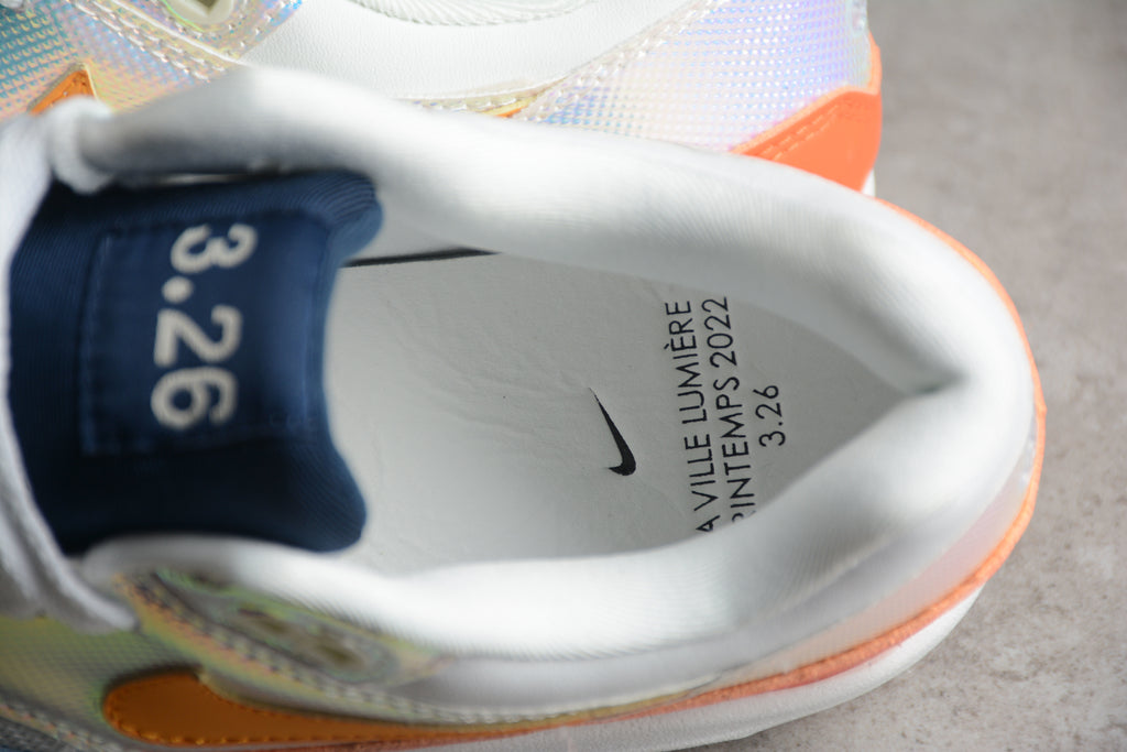 Air Max 1 – Gris / Naranja / Azul