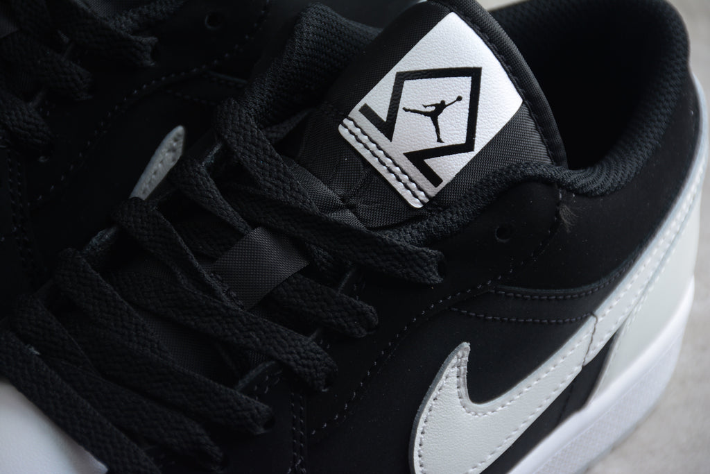 Jordan 1 Low – Negro / Blanco