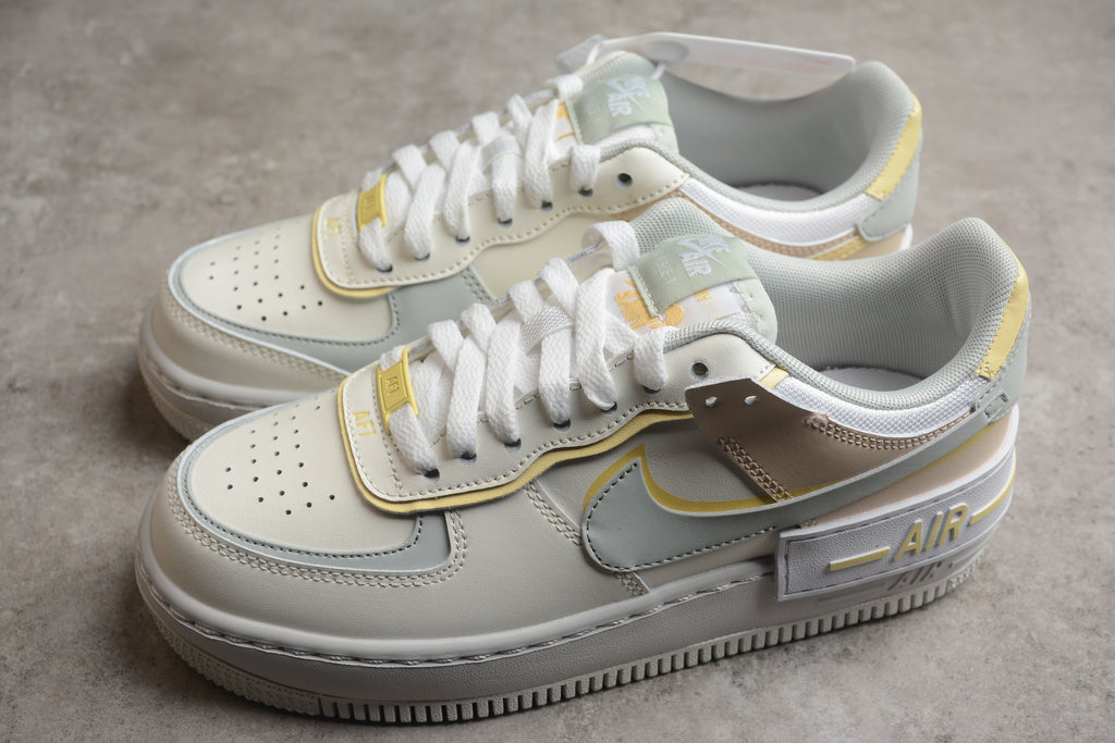 Air Force 1 Shadow – Gris / Rosa / Dorado