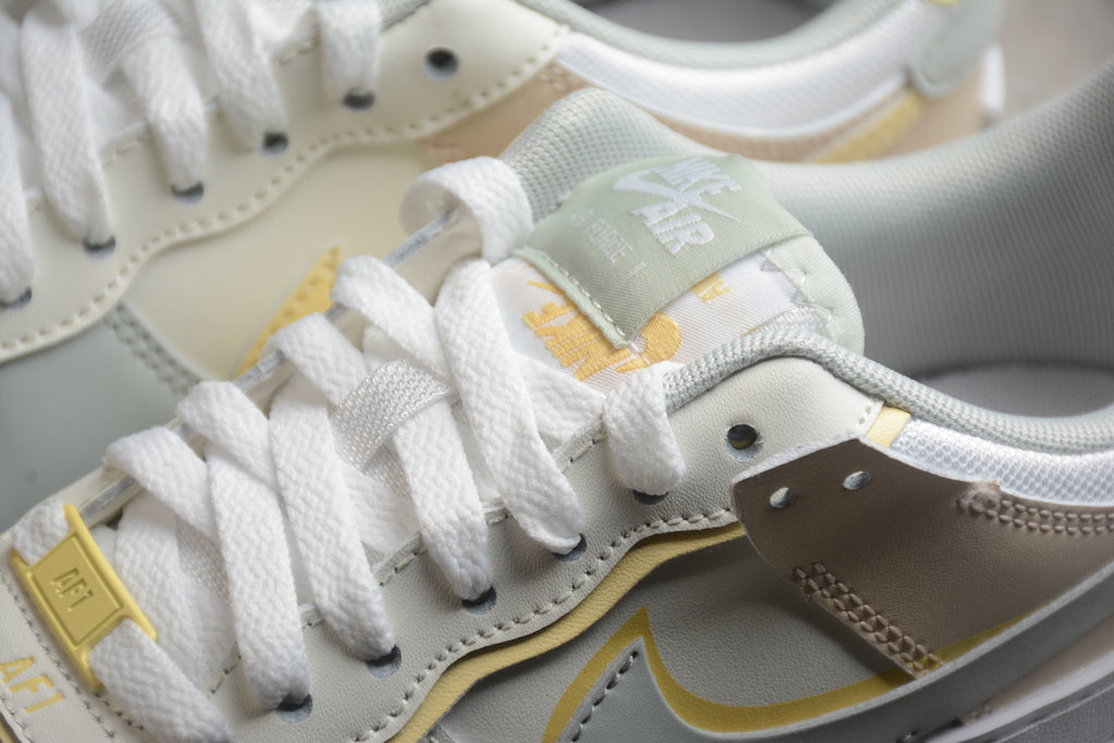 Air Force 1 Shadow – Gris / Rosa / Dorado