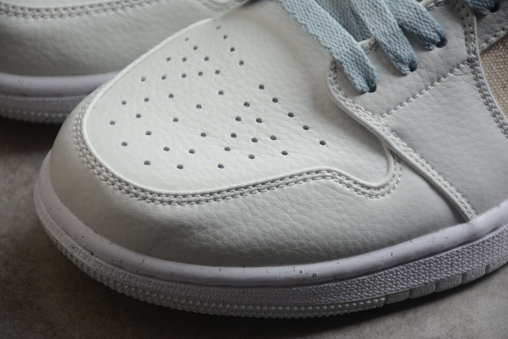 Jordan 1 Low – Gris / Beige / Azul