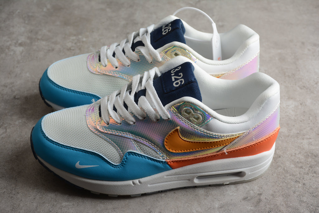 Air Max 1 – Gris / Naranja / Azul