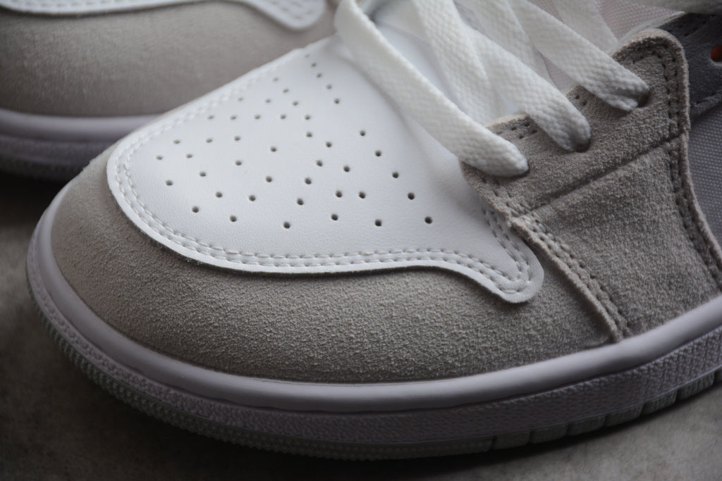 Jordan 1 Low – Gris / Blanco