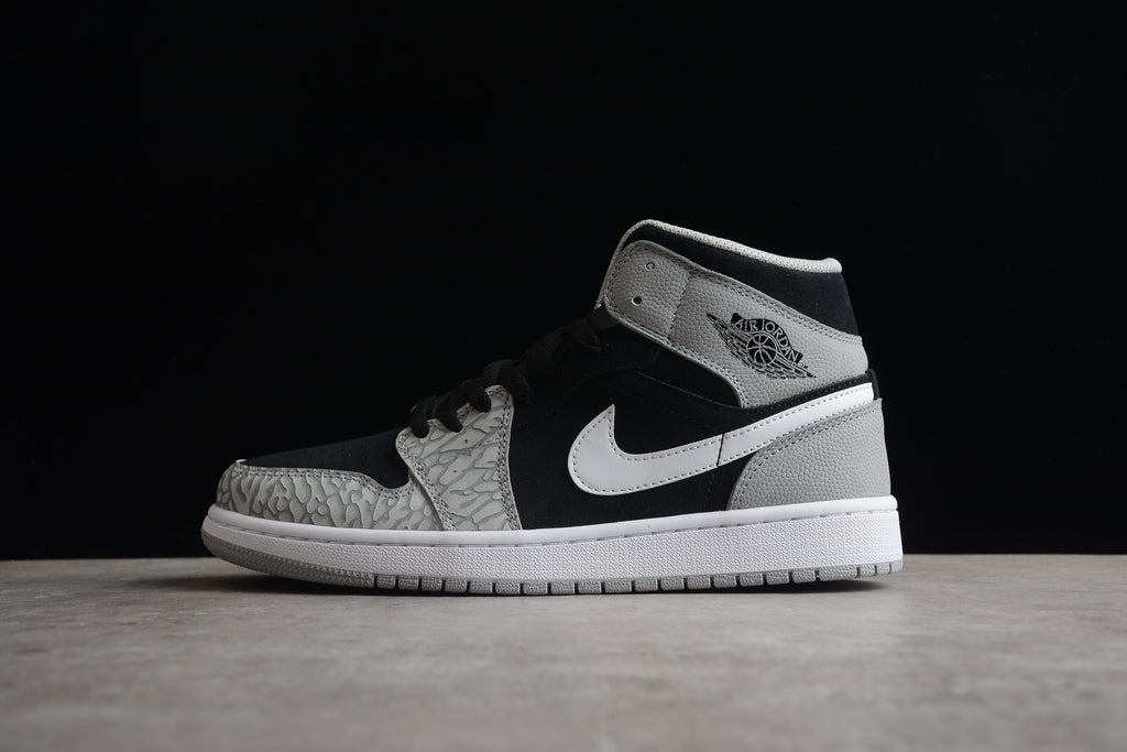 Air Jordan 1 Mid – Gris / Negro