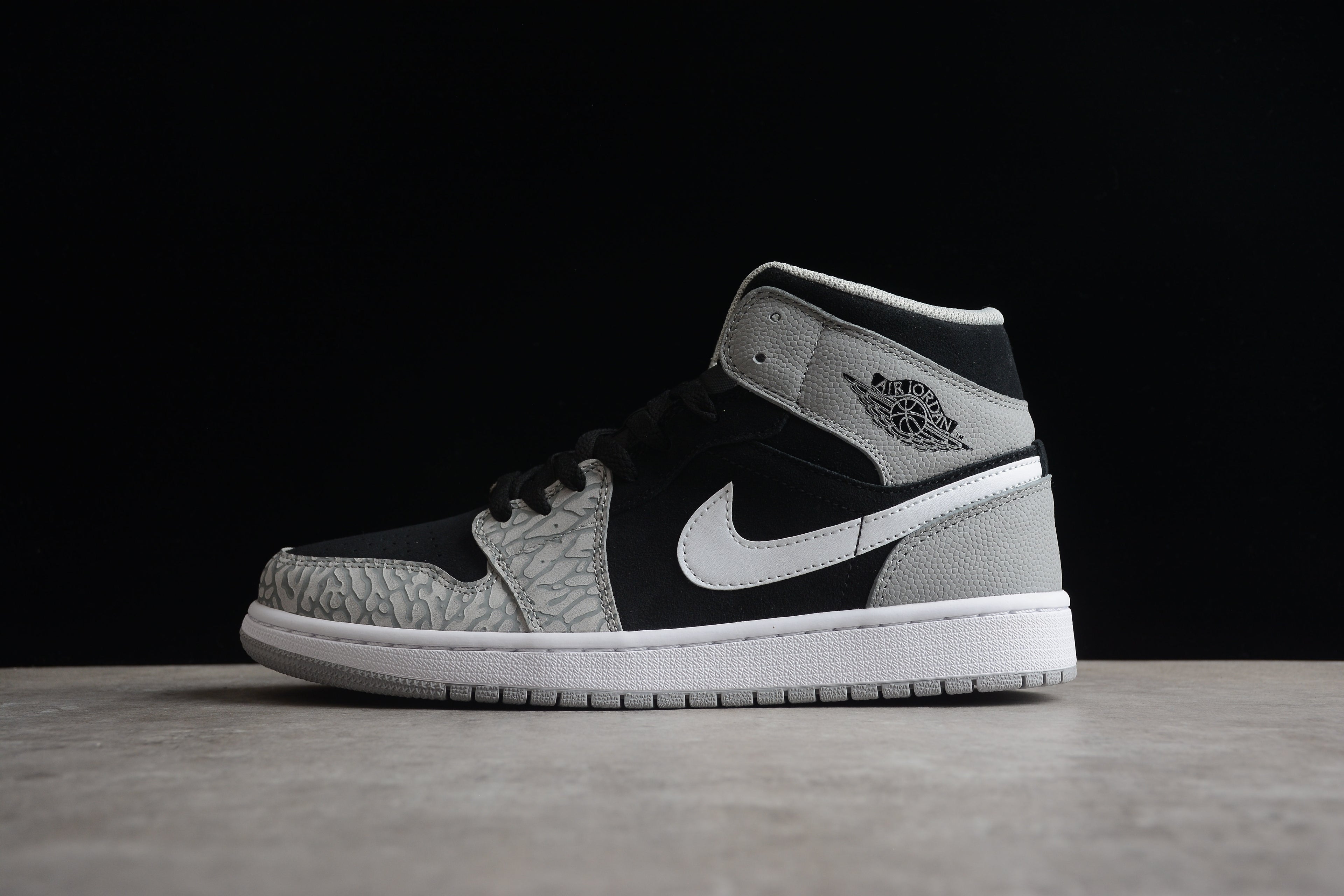 Air Jordan 1 Mid – Gris / Negro