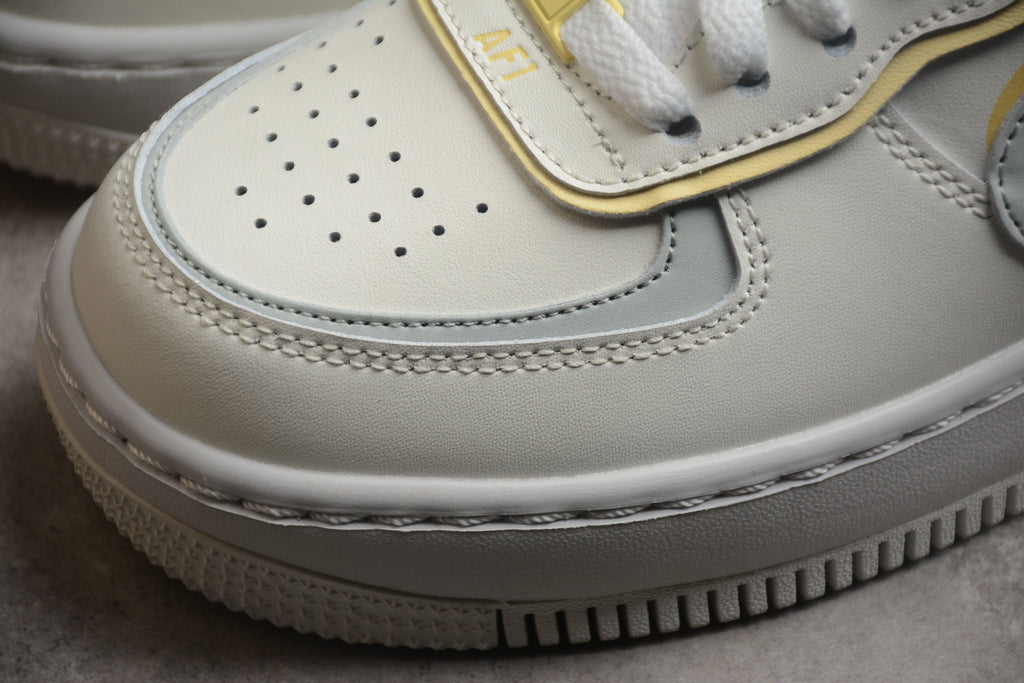 Air Force 1 Shadow – Gris / Rosa / Dorado