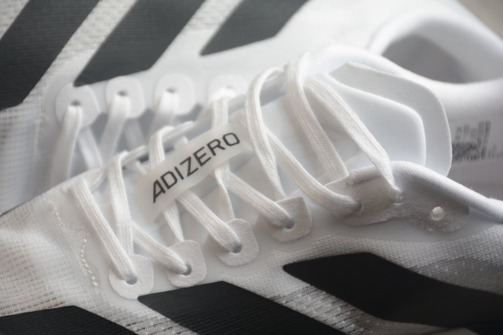 Adidas Adizero Evo SL – Blanco / Negro