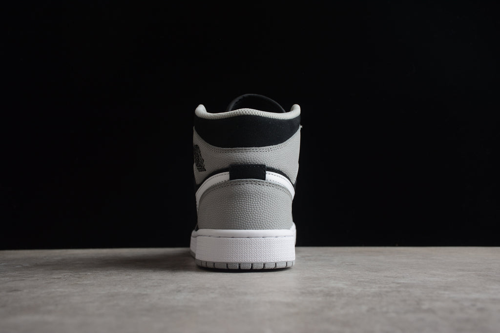 Air Jordan 1 Mid – Gris / Negro