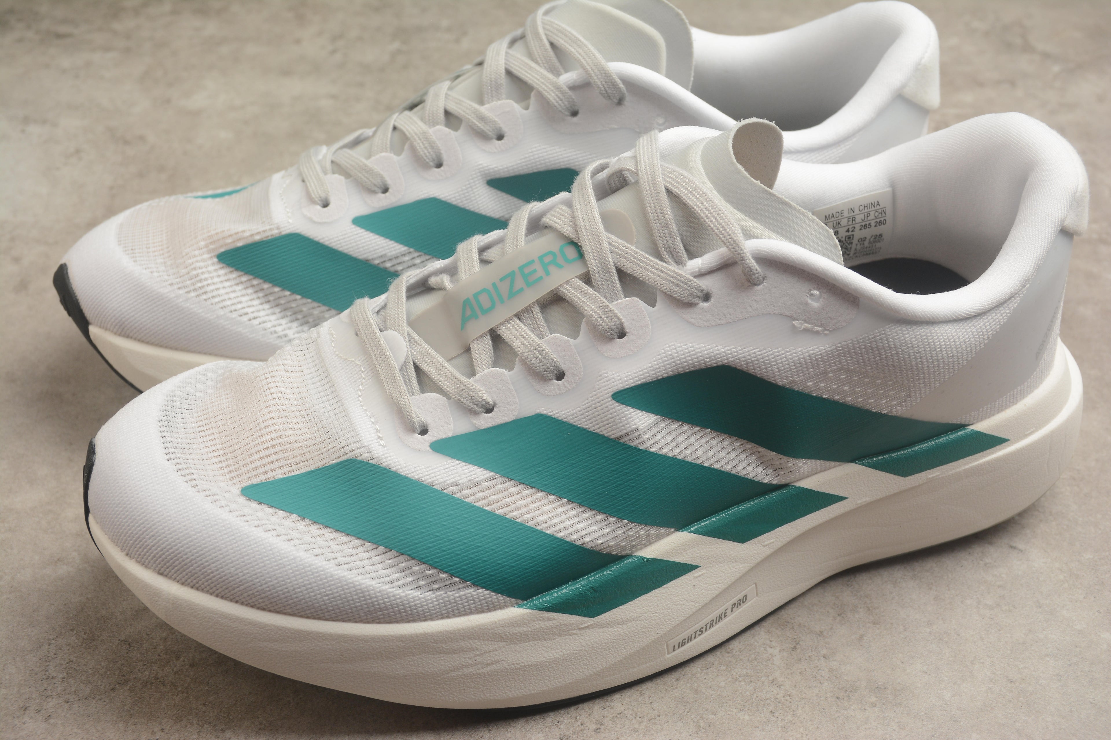 Adidas Adizero Evo SL – Blanco / Turquesa