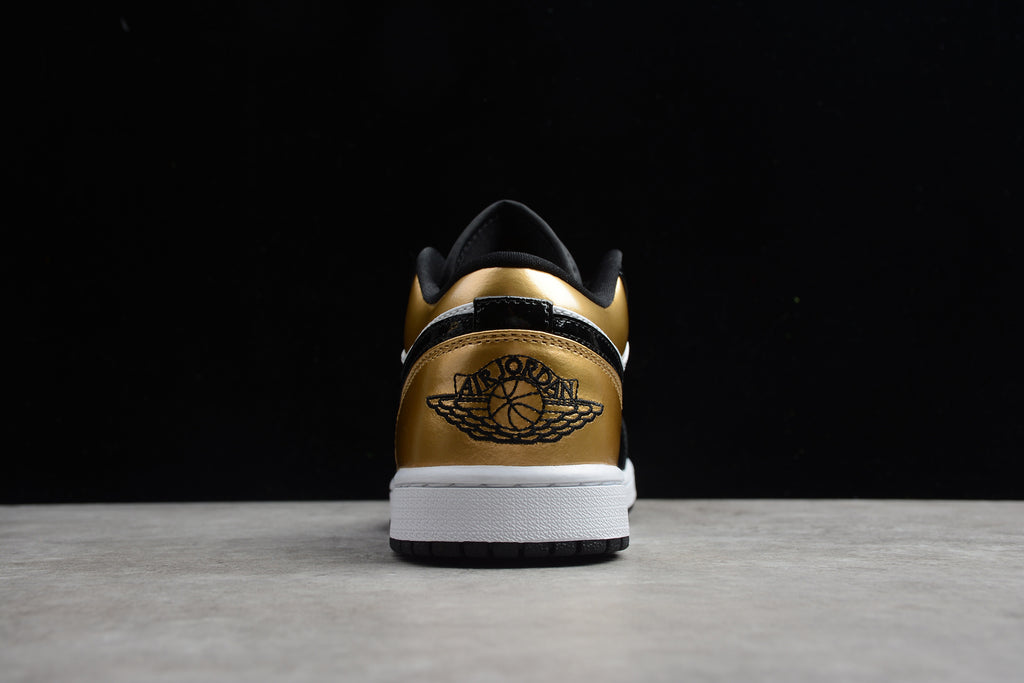 Jordan 1 Low – Negro / Dorado