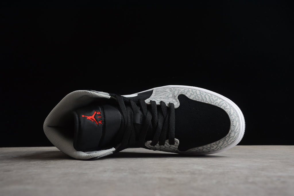 Air Jordan 1 Mid – Gris / Negro