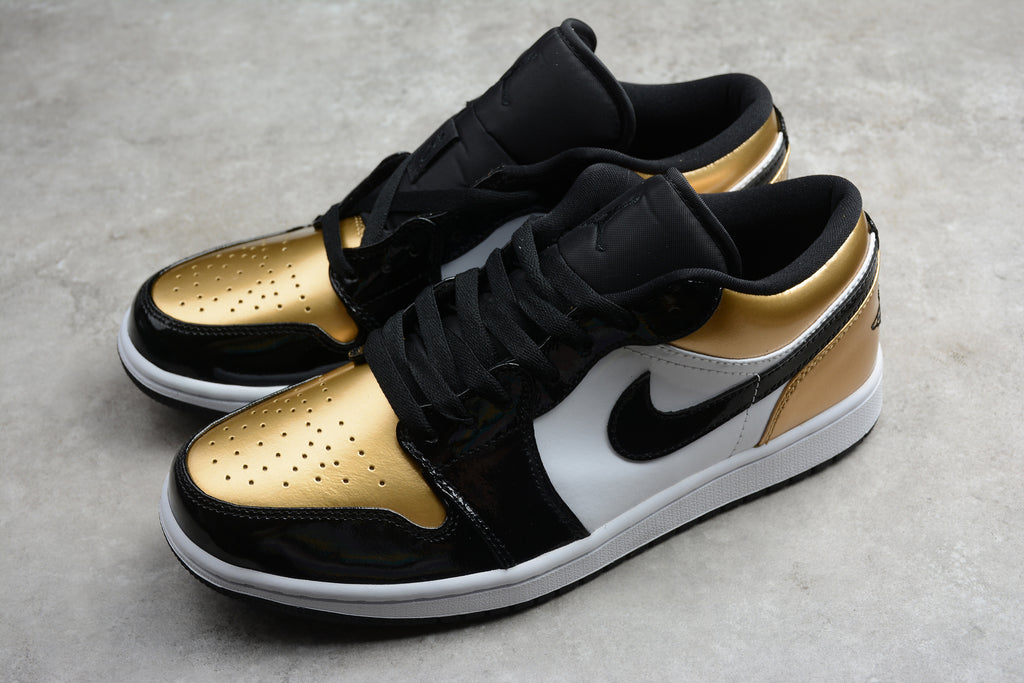 Jordan 1 Low – Negro / Dorado