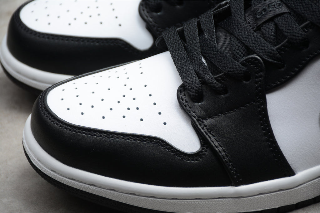 Jordan 1 Low – Negro / Blanco / Gris