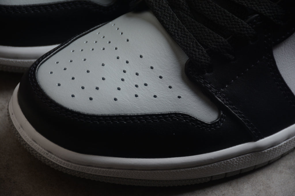 Jordan 1 Low – Beige / Negro / Blanco