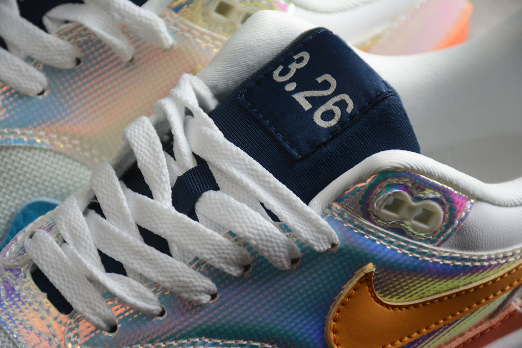 Air Max 1 – Gris / Naranja / Azul