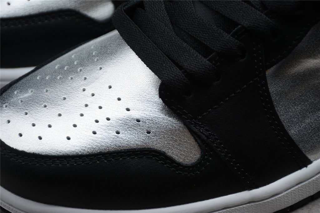 Jordan 1 Low – Negro / Plata